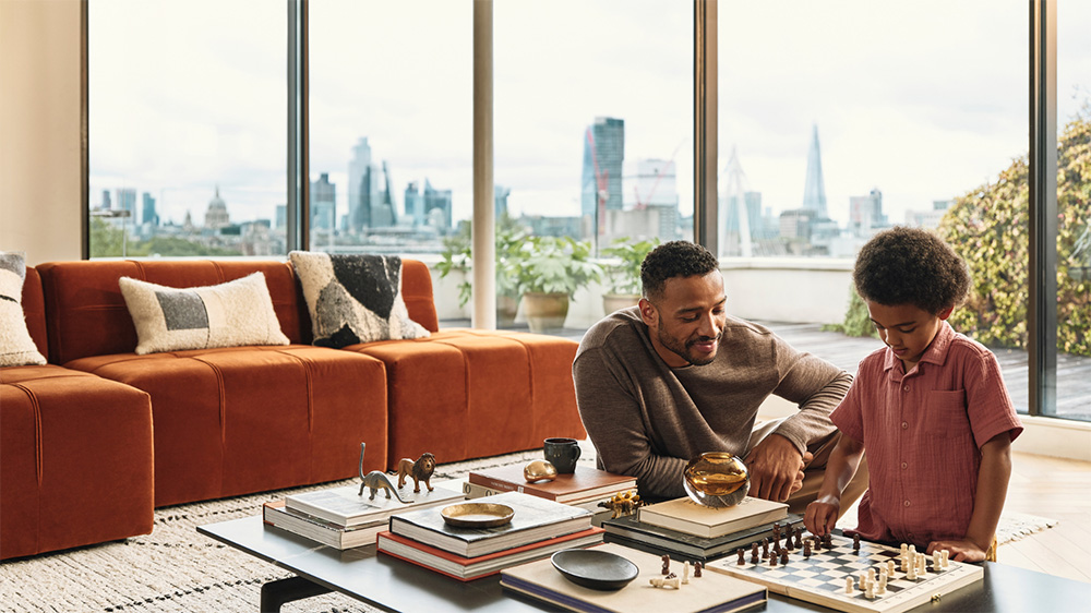 Father and son playing games at home