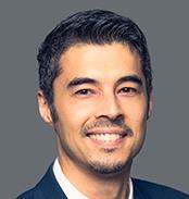 Headshot of Travis Huggins