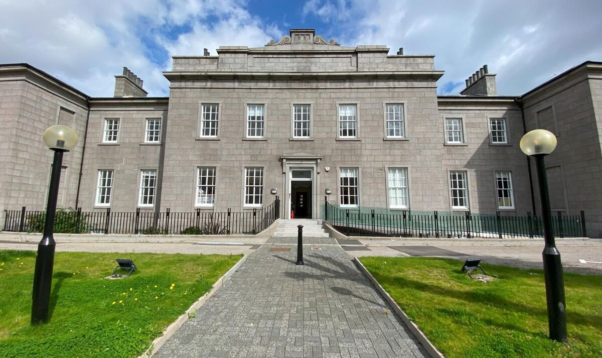 Refurbished office suites within imposing granite building
