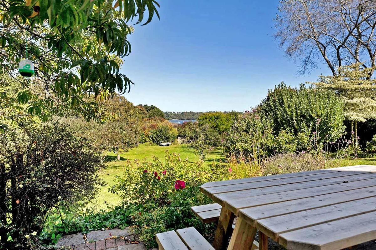 Set within delightful orchard gardens and with stunning views over the