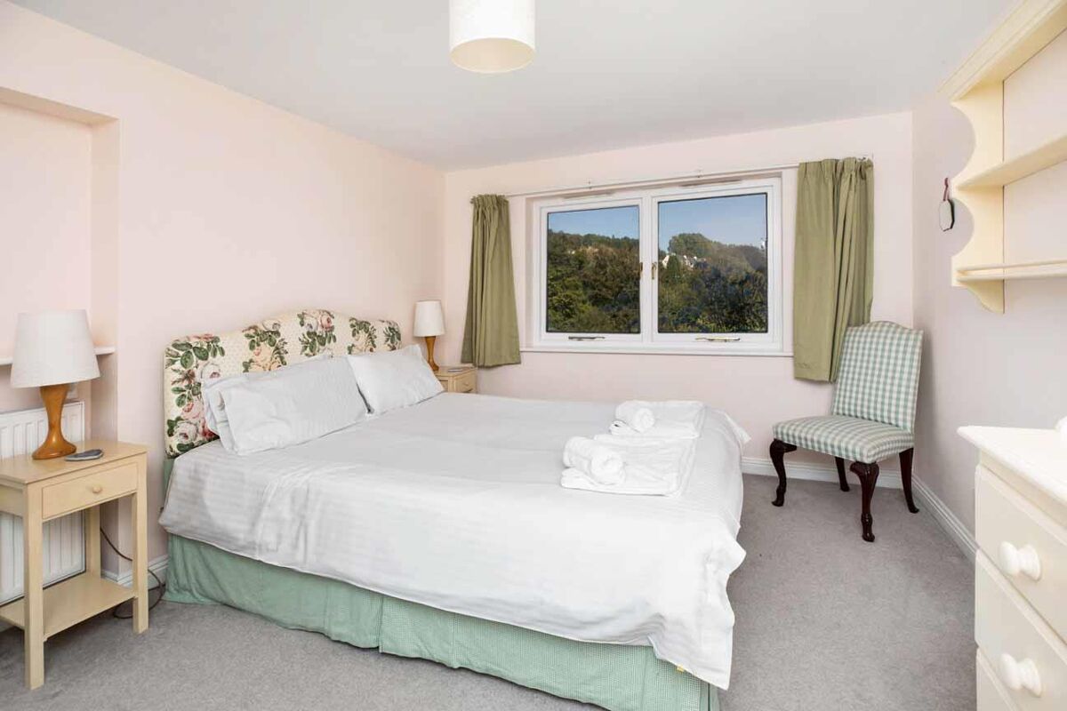 Set within delightful orchard gardens and with stunning views over the