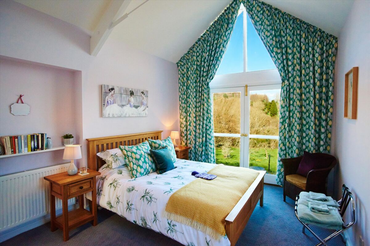 Set within delightful orchard gardens and with stunning views over the