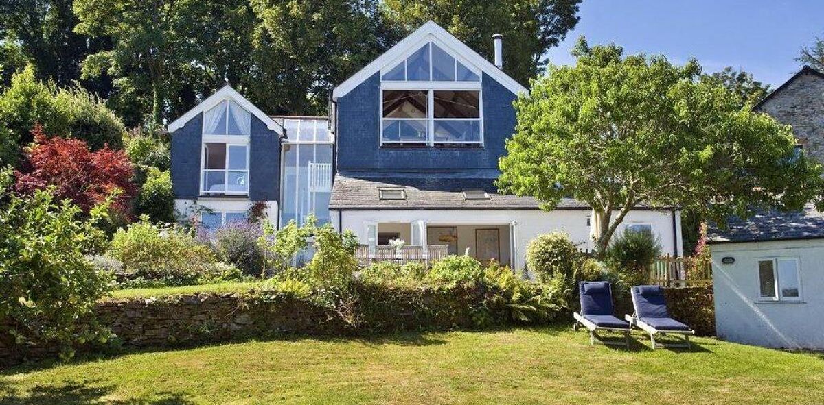 Set within delightful orchard gardens and with stunning views over the