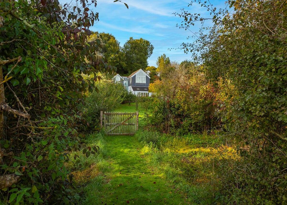 Set within delightful orchard gardens and with stunning views over the